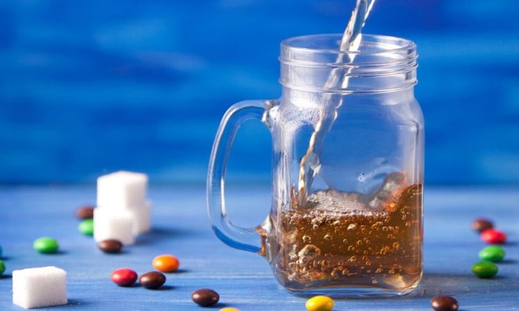 Pouring-tea-on-glass jar